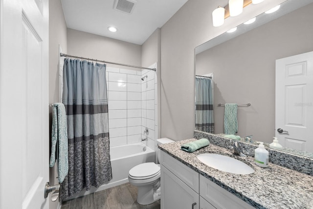 full bathroom featuring vanity, shower / bathtub combination with curtain, and toilet