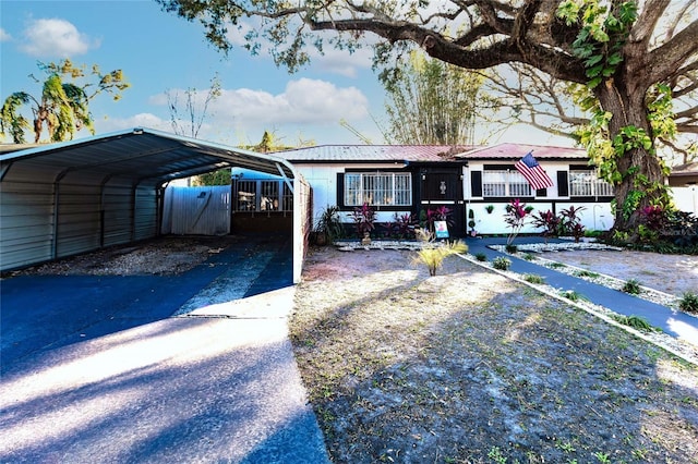 view of front of home with a carport