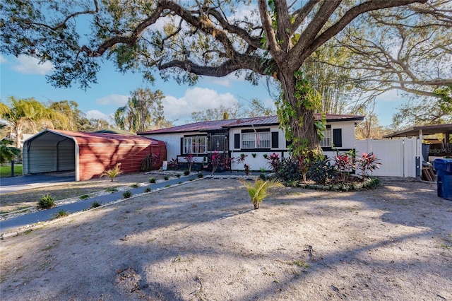 ranch-style home with a carport