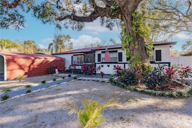 view of front facade with a carport