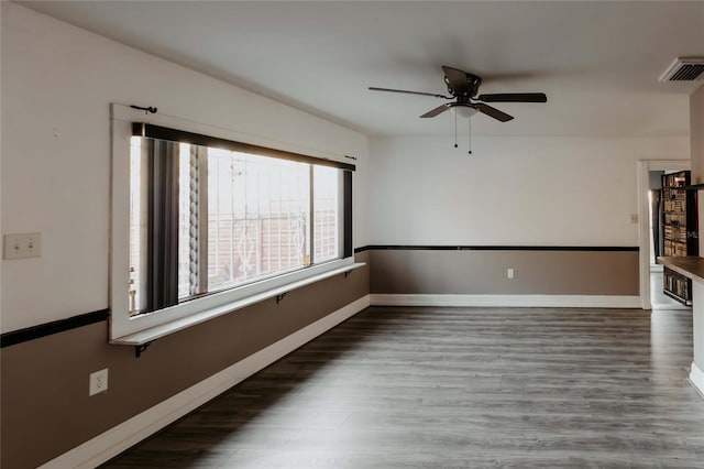2005 E Crenshaw St, Tampa, FL 33610 - spare room featuring ceiling fan and dark wood-type flooring