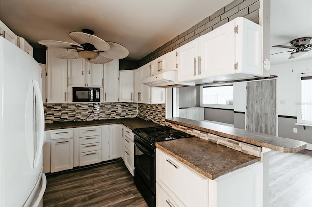 2005 E Crenshaw St, Tampa, FL 33610 - kitchen with kitchen peninsula, black appliances, tasteful backsplash, white cabinetry, and ceiling fan