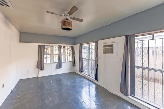 2005 E Crenshaw St, Tampa, FL 33610 - spare room with a wall mounted AC and ceiling fan