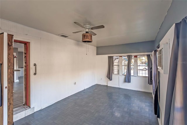 2005 E Crenshaw St, Tampa, FL 33610 - empty room with dark parquet flooring and ceiling fan