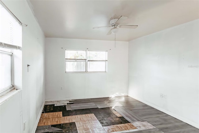 2005 E Crenshaw St, Tampa, FL 33610 - spare room with ceiling fan and dark parquet flooring