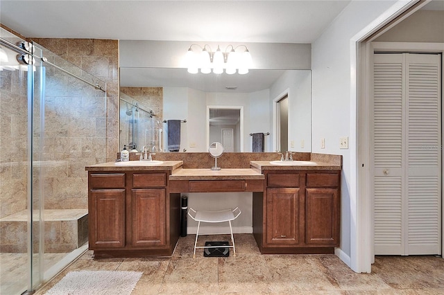 bathroom with an enclosed shower and vanity