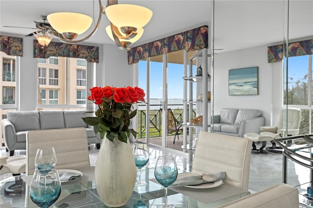 dining room featuring a notable chandelier and a wealth of natural light