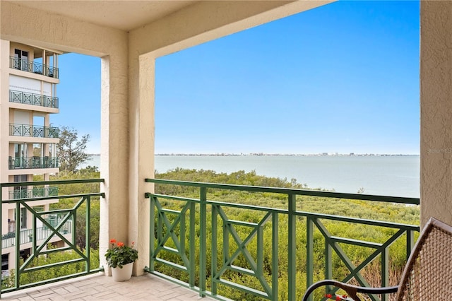 balcony featuring a water view