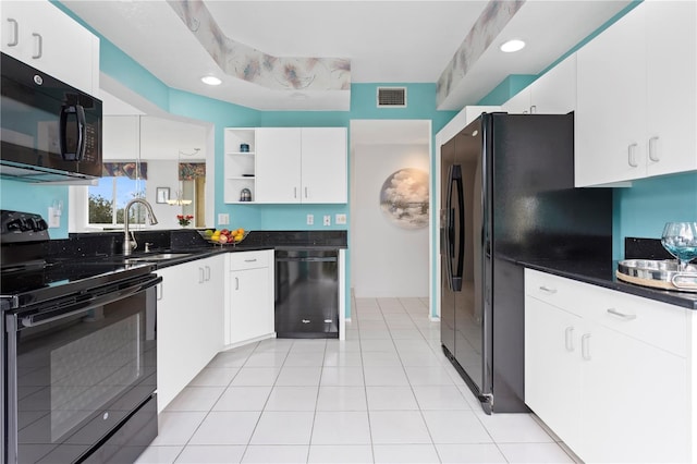 kitchen featuring sink, white cabinets, and black appliances