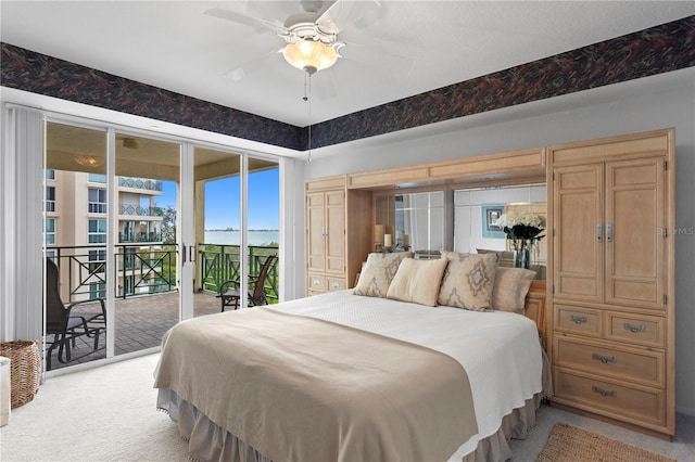 bedroom with ceiling fan, light carpet, and access to outside