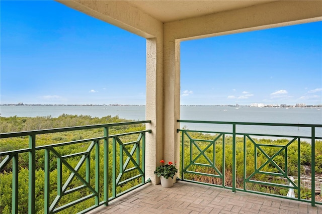 balcony featuring a water view