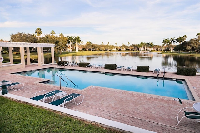 view of pool featuring a water view, a pergola, and a patio area