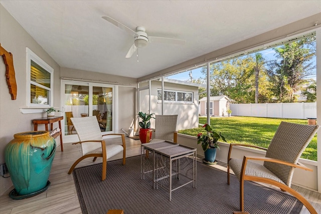 sunroom / solarium with ceiling fan