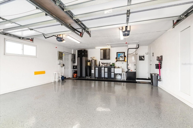 garage with electric water heater and a garage door opener