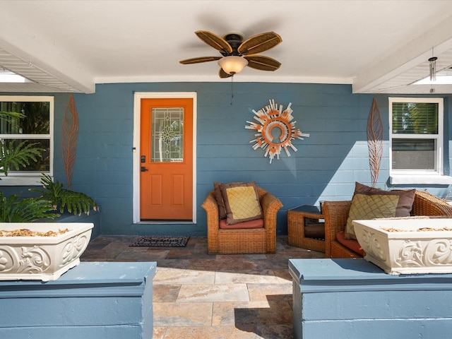 doorway to property with ceiling fan