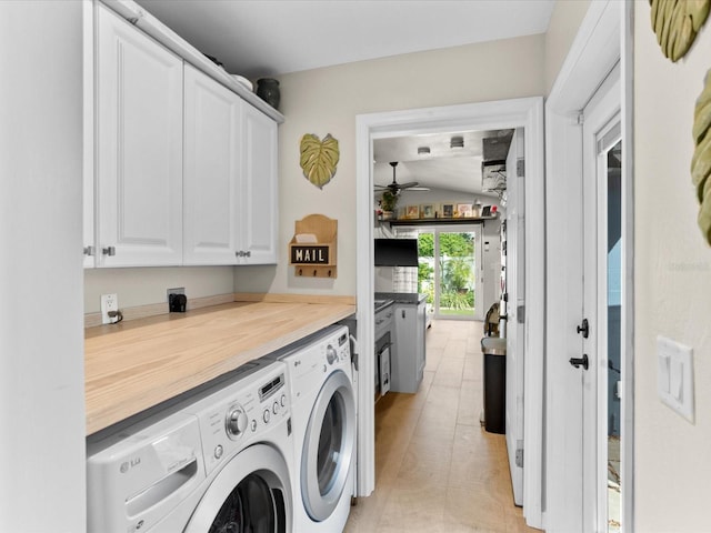 laundry room with cabinets, ceiling fan, and washer and clothes dryer