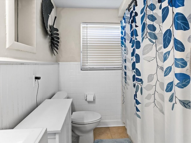 bathroom featuring tile patterned flooring, vanity, and toilet