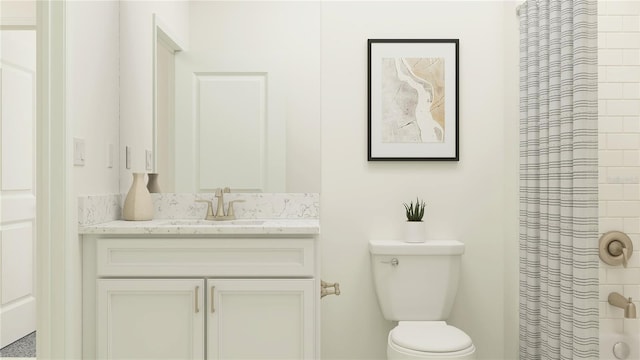 bathroom with vanity, toilet, and curtained shower