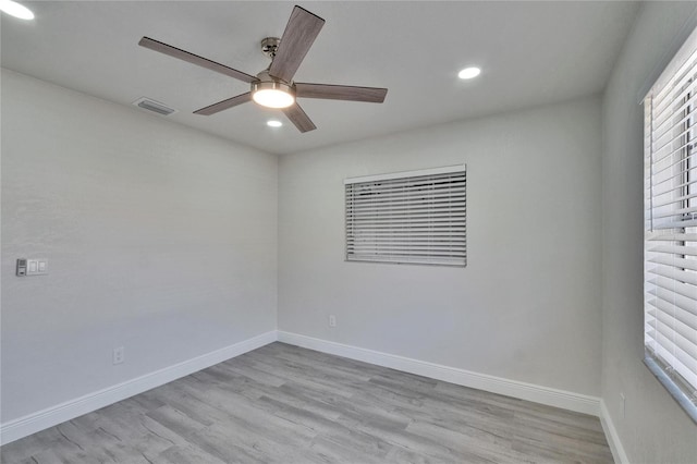 empty room featuring ceiling fan and light hardwood / wood-style flooring