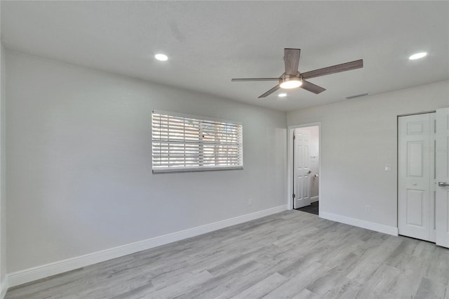 unfurnished bedroom with ceiling fan and light hardwood / wood-style flooring