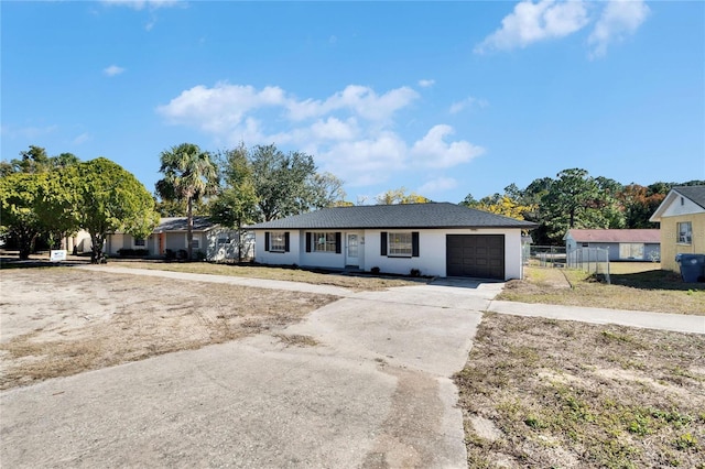 single story home with a garage