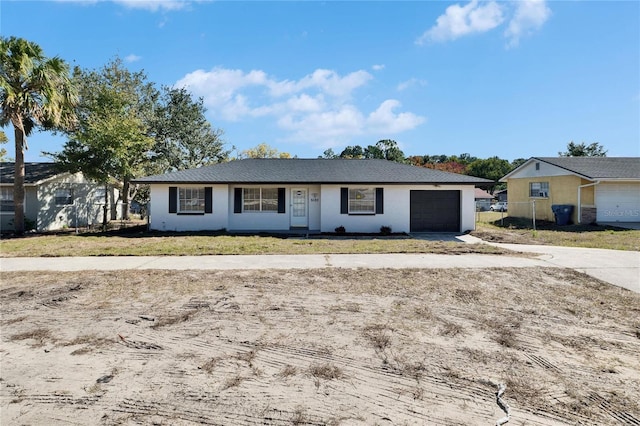 single story home featuring a garage