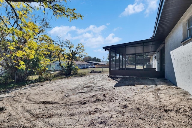 view of yard with a sunroom