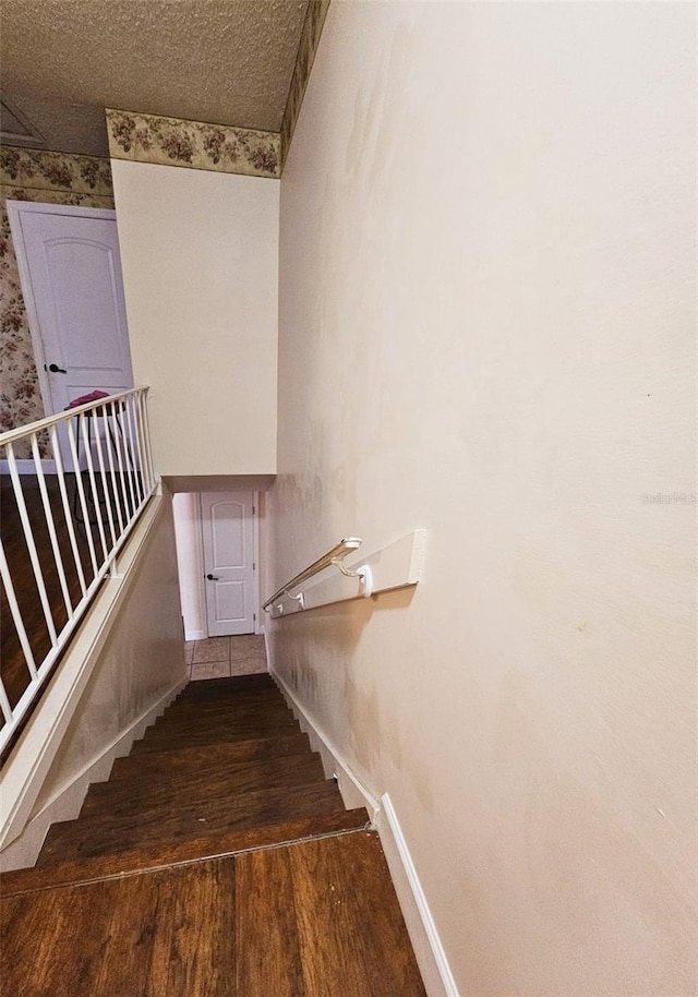 stairway featuring hardwood / wood-style flooring