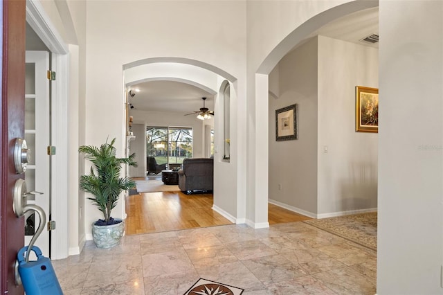 foyer featuring ceiling fan