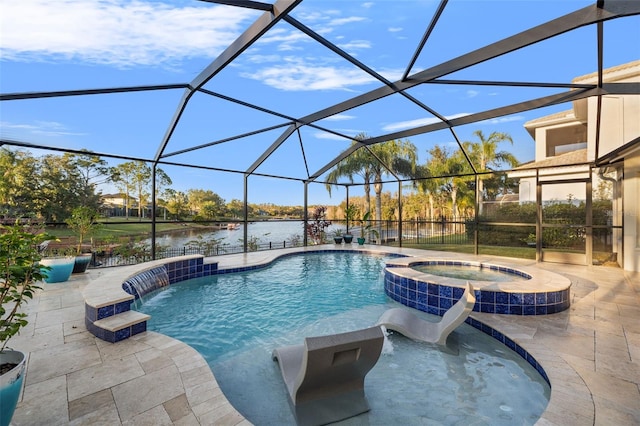 view of swimming pool featuring pool water feature, a patio area, a water view, glass enclosure, and an in ground hot tub