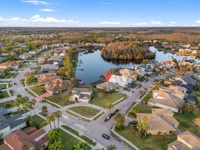 birds eye view of property with a water view