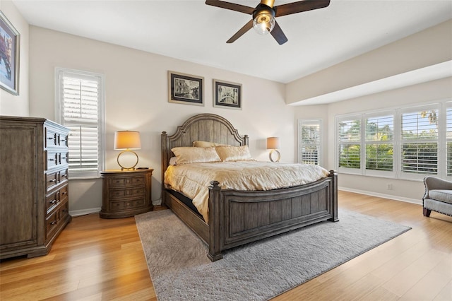 bedroom featuring light hardwood / wood-style floors and ceiling fan