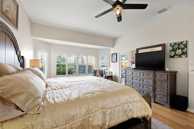 bedroom with ceiling fan and light hardwood / wood-style floors