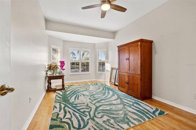 sitting room with ceiling fan and light hardwood / wood-style floors