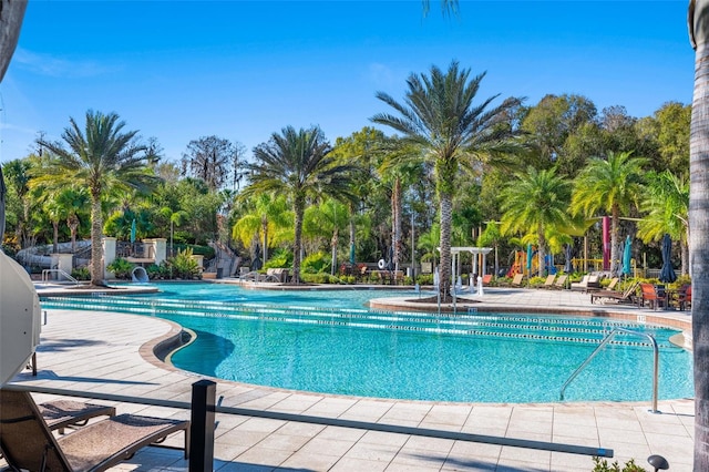 view of swimming pool with a patio area