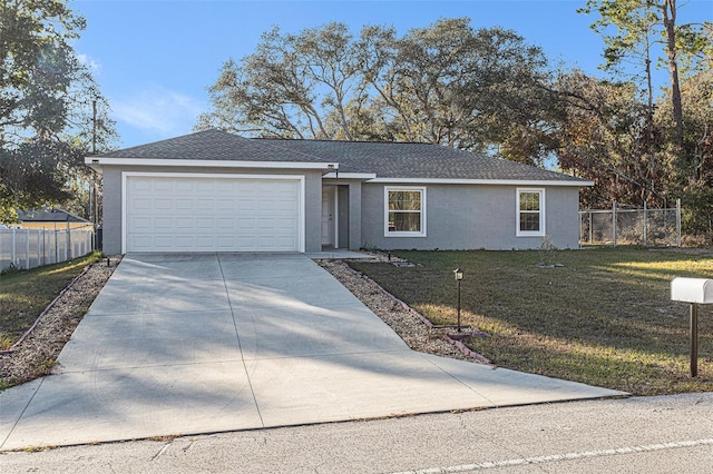 ranch-style home with a garage and a front lawn