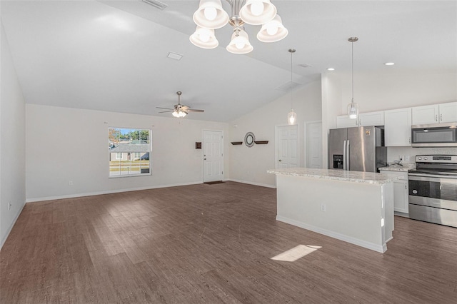 kitchen featuring white cabinets, ceiling fan with notable chandelier, hanging light fixtures, dark hardwood / wood-style flooring, and stainless steel appliances