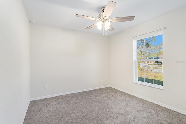 unfurnished room featuring carpet floors, plenty of natural light, and ceiling fan