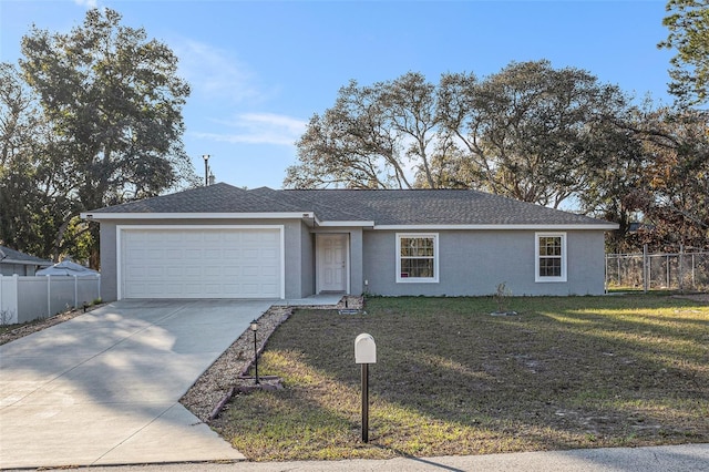 ranch-style house with a garage and a front lawn