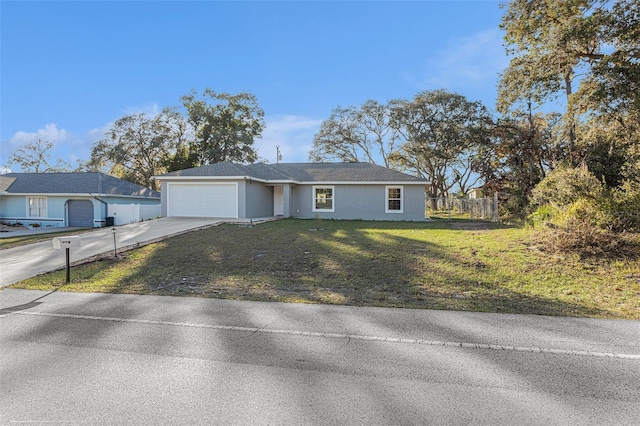 single story home with a front lawn and a garage