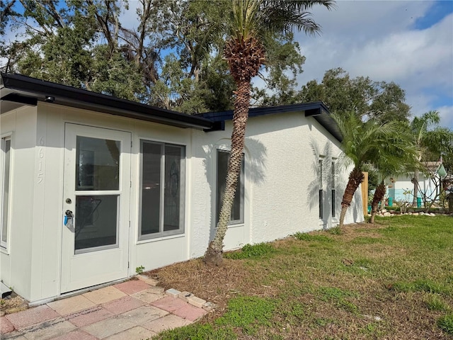 view of side of home featuring a yard