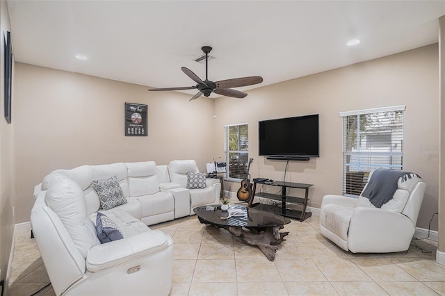 living room with light tile patterned floors and ceiling fan