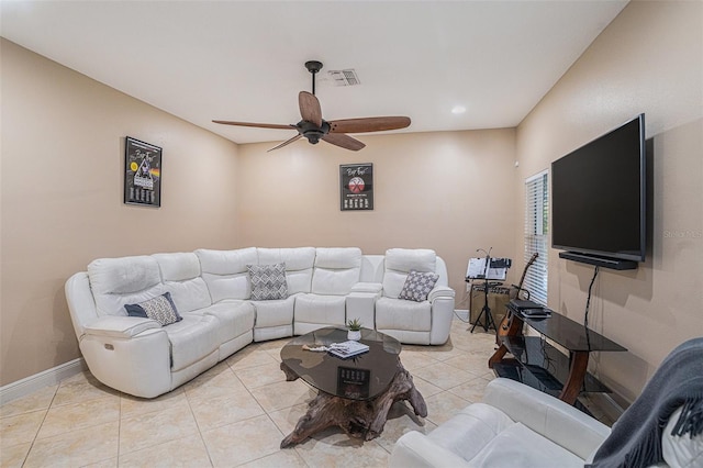 living room featuring ceiling fan and light tile patterned flooring