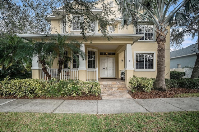 view of front of property featuring covered porch