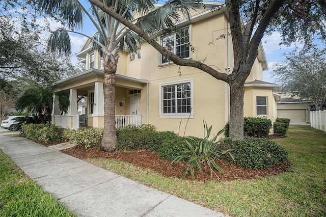 view of front of house with a front lawn and a porch