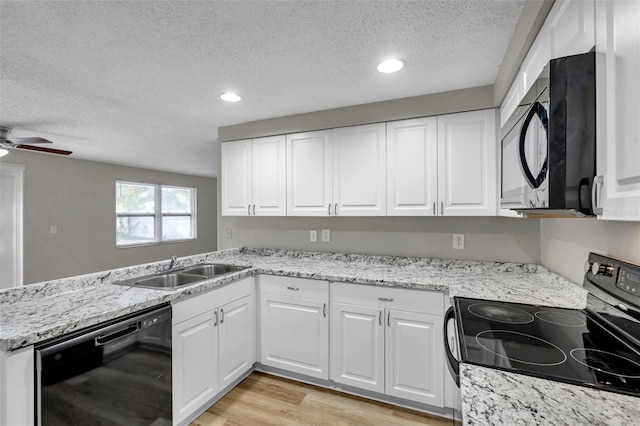 kitchen featuring a textured ceiling, black dishwasher, white cabinetry, and electric stove