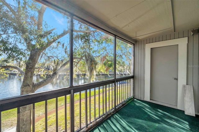 6311 Newtown Cir Unit 11B1, Tampa, FL 33615 - unfurnished sunroom with a water view and plenty of natural light