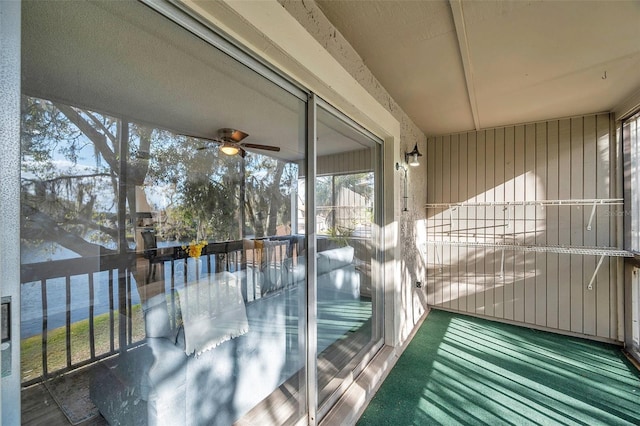 6311 Newtown Cir Unit 11B1, Tampa, FL 33615 - unfurnished sunroom featuring a ceiling fan