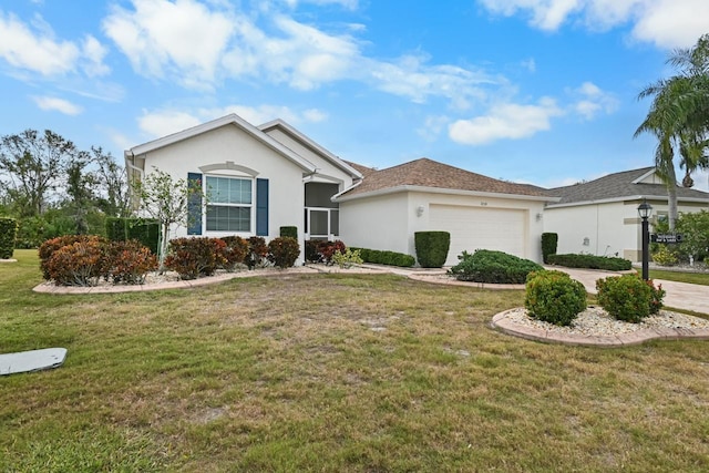 single story home with a garage and a front lawn