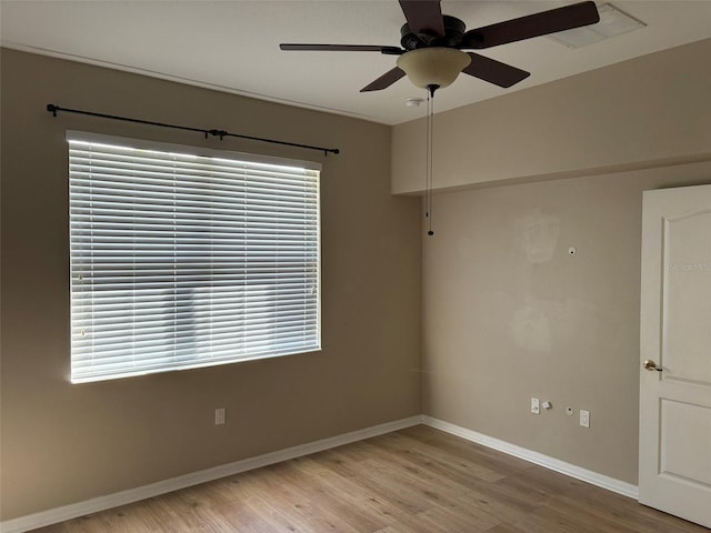 unfurnished room with ceiling fan and light hardwood / wood-style flooring